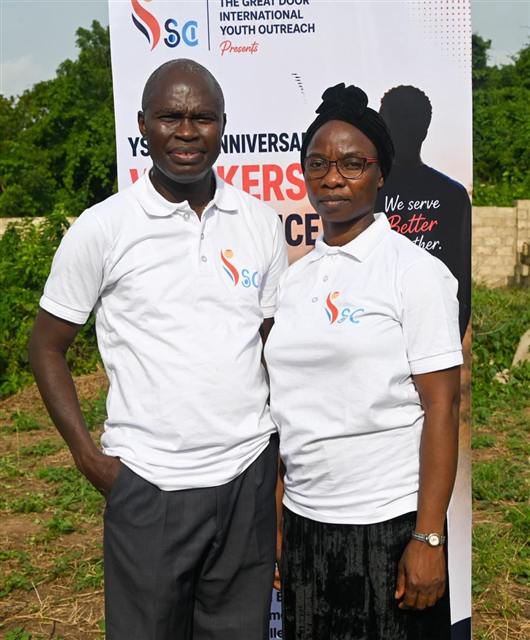 Pastor and Mrs. Olayiwola standing together at the conference
